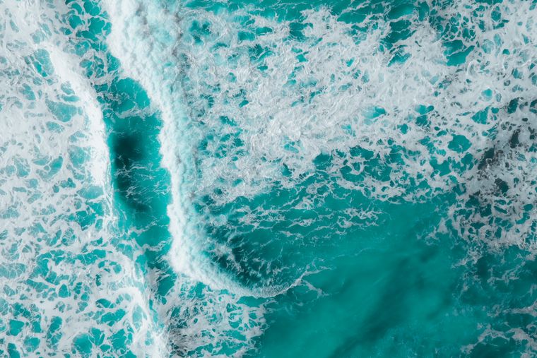 Turquoise ocean waves from above, photo by Pok Rie on Pexels