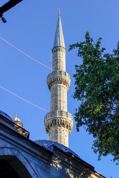 Free A minaret of the Blue Mosque in Istanbul reaching towards a clear blue sky. Stock Photo