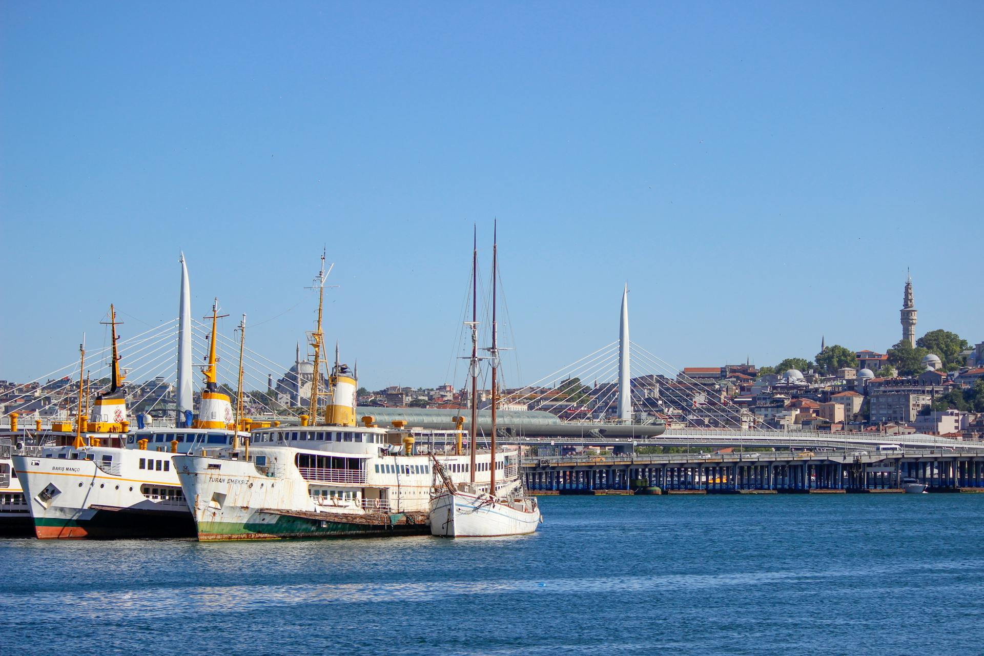 Ships Moored Next to Bridge