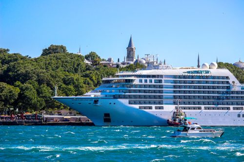 Free A majestic cruise ship sails through the Bosphorus Strait with a historic Istanbul skyline in the backdrop. Stock Photo