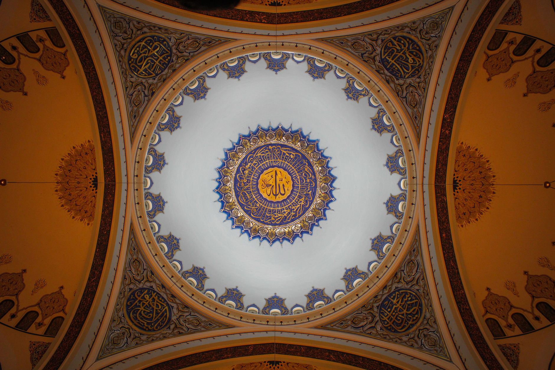 Captivating view of Camlica Mosque's ornate dome ceiling, featuring intricate Islamic art.