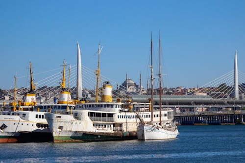 Photo of Ships on the Bosporus with the Süleymaniye Mosque in the Background in Istanbul, Turkey