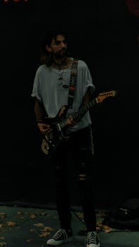 A musician plays an electric guitar during a nighttime performance in Istanbul.