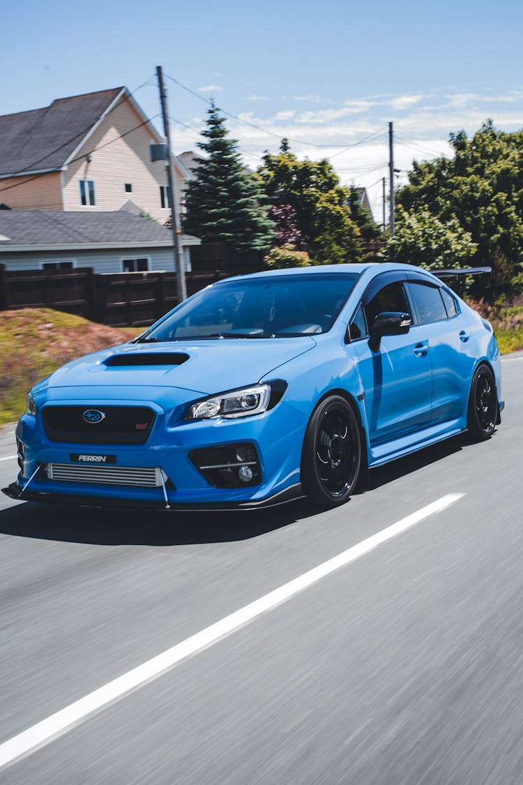 Blue Sports Car On The Road