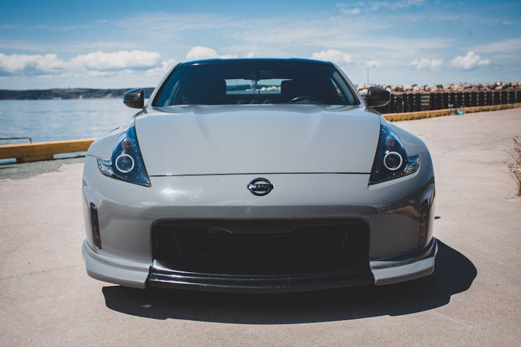 Photo Of A Grey Sporting Nissan Z Car Standing On The Pier