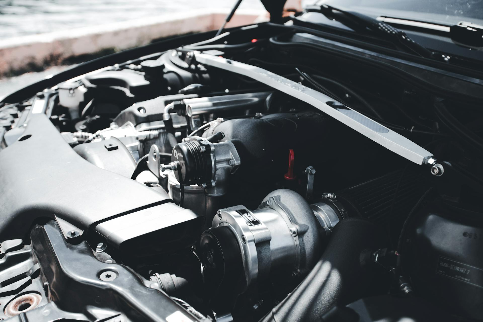 Detailed view of a car engine showcasing metal components and automotive technology.