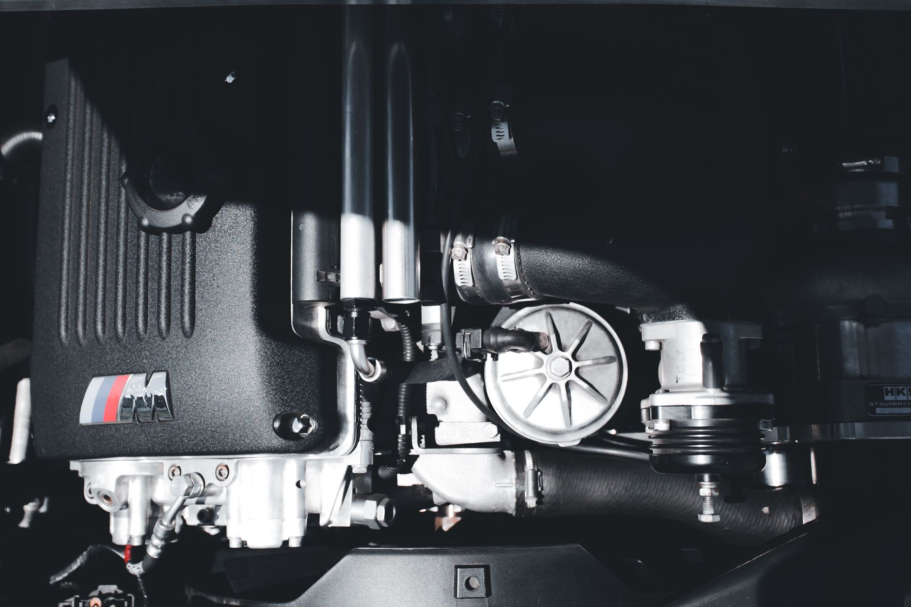 Close-up of a high-performance car engine showcasing intricate parts.