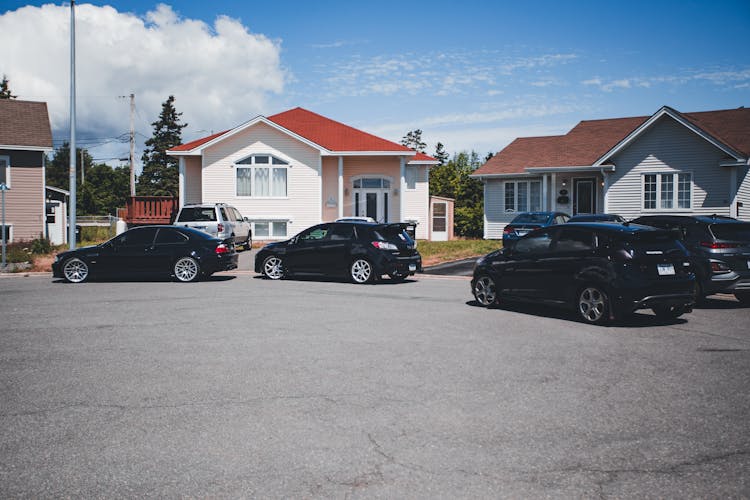 Cars Parked In Front Of Houses