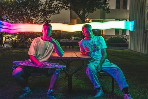 Men Sitting at the Wooden Table