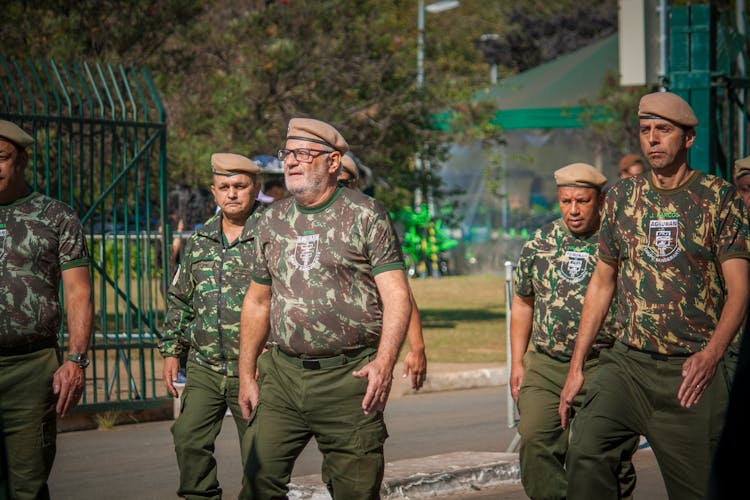 Group Of Men In Military Uniforms Parading