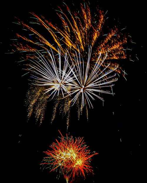 Free Stunning fireworks captured in vibrant colors illuminating the night sky, perfect for festive celebrations. Stock Photo