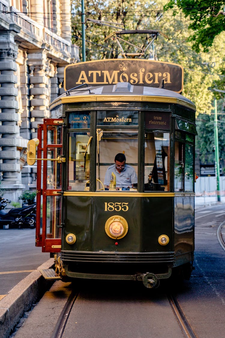 Man Driving The Atmosfera Tram Restaurant In Milan, Italy