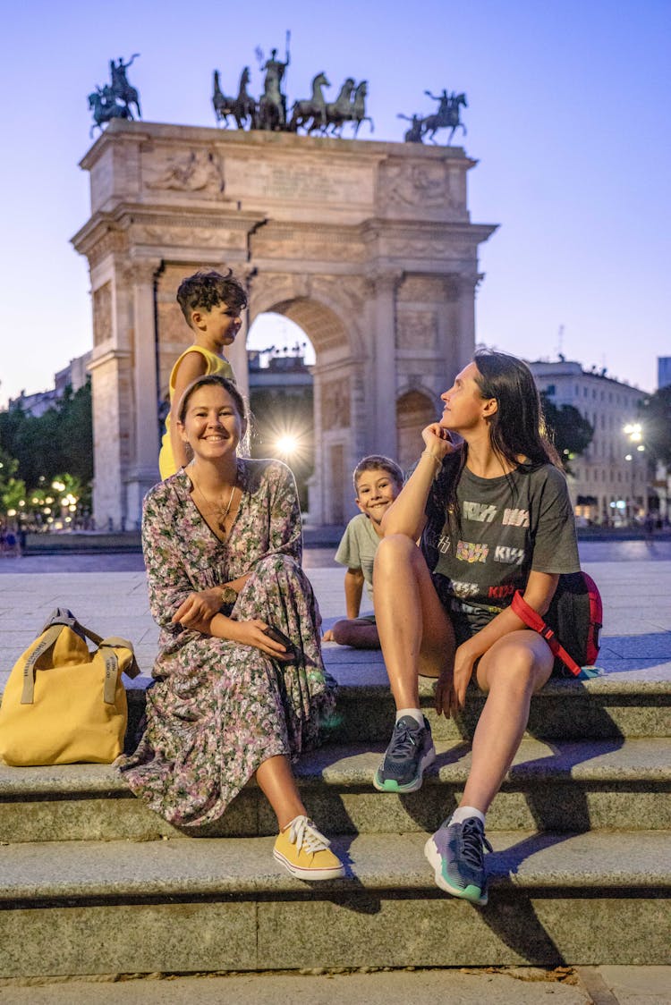 Family Sitting On The Steps 