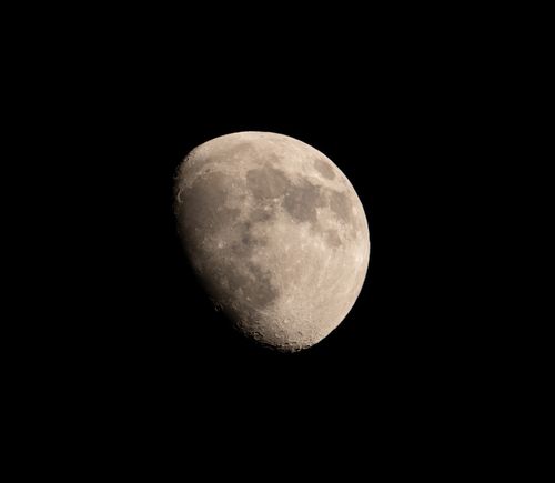 Free A serene capture of the moon's surface detail against a dark night sky. Stock Photo