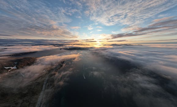 Stunning sunset over clouds and landscape in Kangiqsujuaq, Canada.