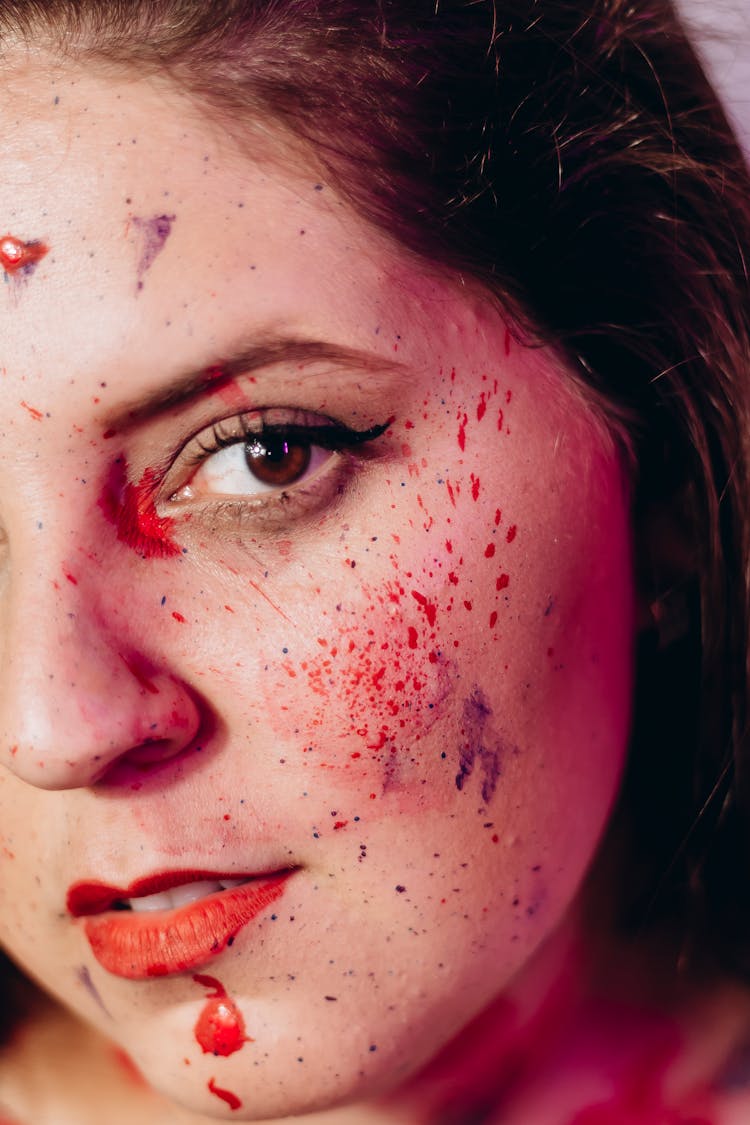 Paint Splatters On The Face Of A Woman