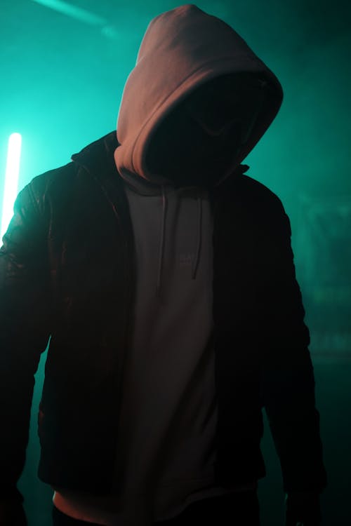 Man in Gray Hoodie Wearing Mask