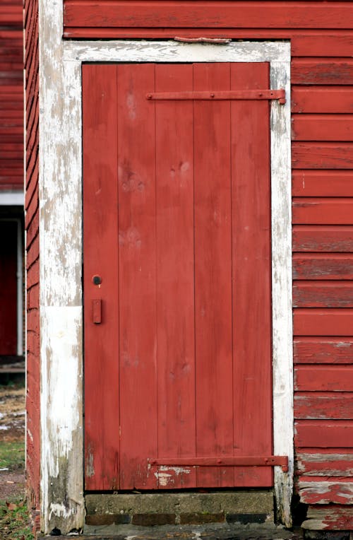 Close Up Photo of Red Wooden Door