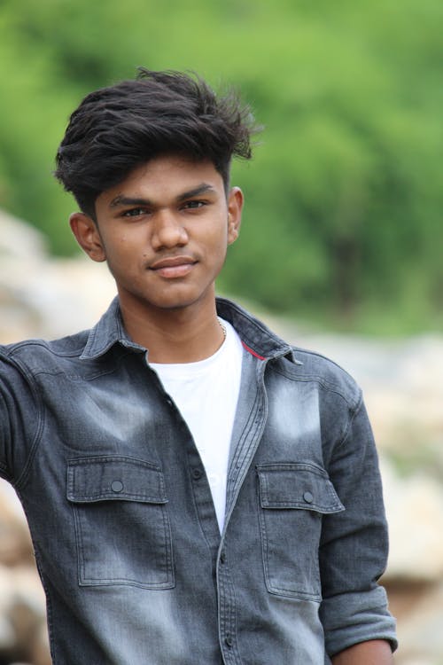 Young Man in White Shirt with Denim Jacket