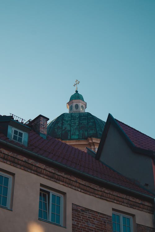 Photo of Buildings and a Dome of a Church