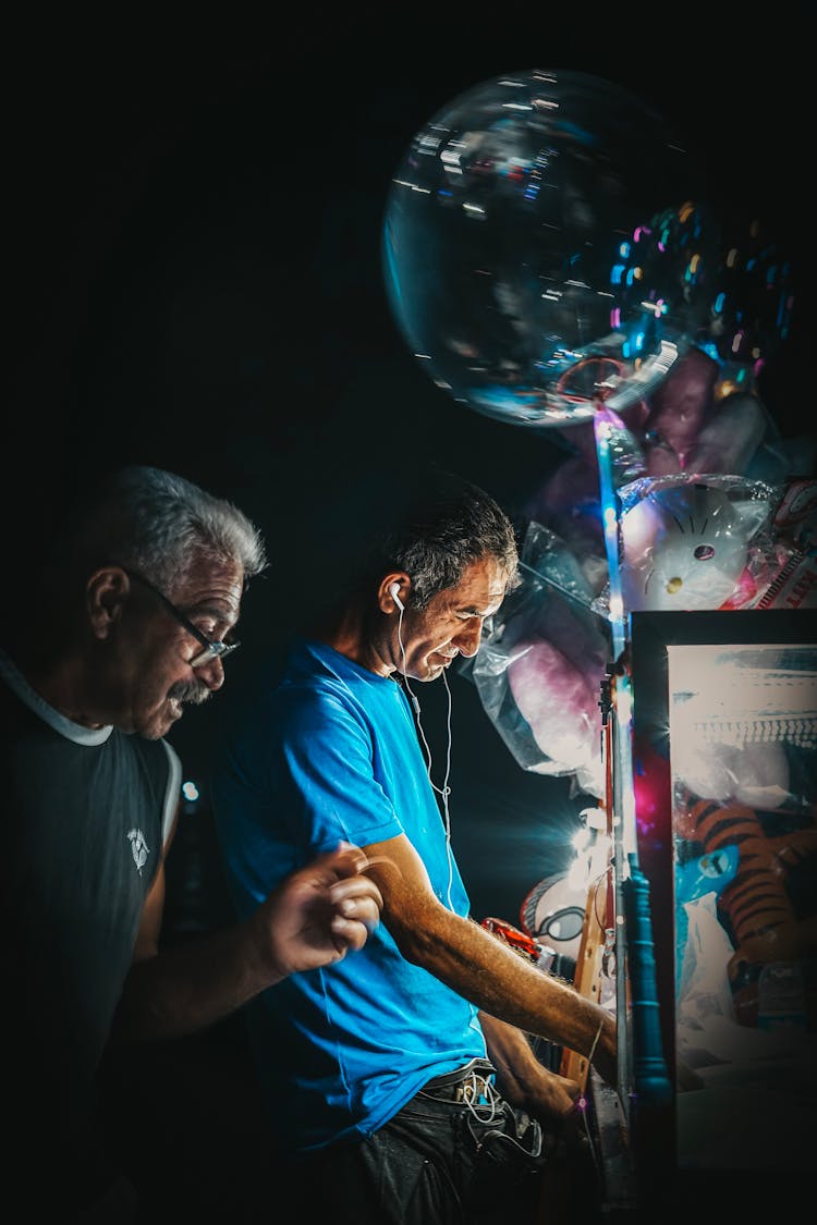 Men Selling Balloons At Night Street