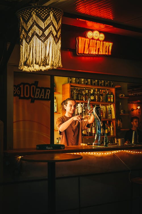 Man Filling a Glass with Beer