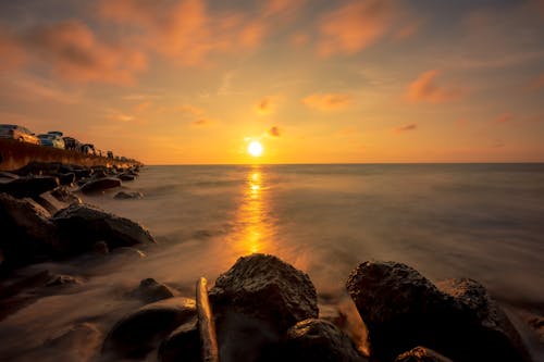 Безкоштовне стокове фото на тему «берег, вода, Захід сонця»