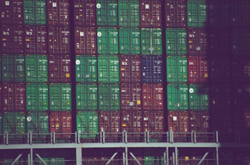 Stack of Different Colors of Cargo Containers