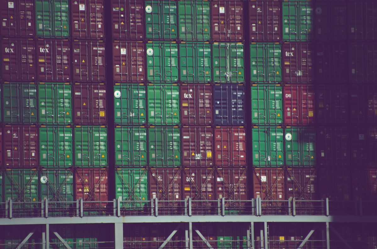 Vibrant cargo containers stacked at Hamburg port, Germany, showcasing global trade.