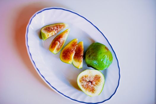 Slices of Green Fruit on White Ceramic Plate