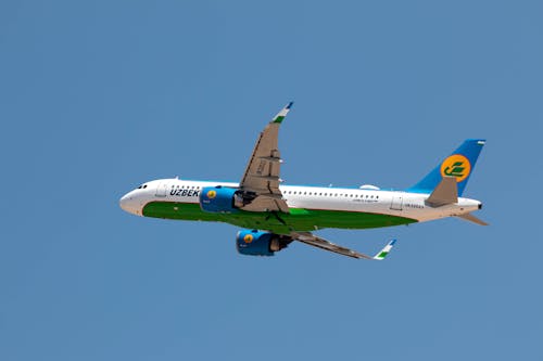 Passenger Plane Flying in the Blue Sky