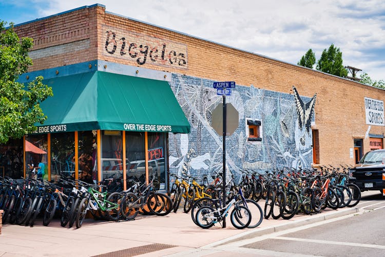 Corner Of A Bicycle Shop With A Turquoise Sunshade