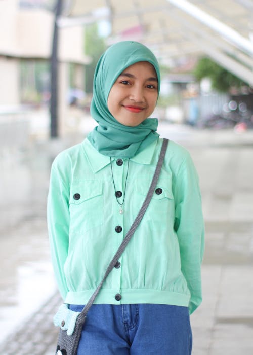 Smiling Girl Wearing a Green Hijab