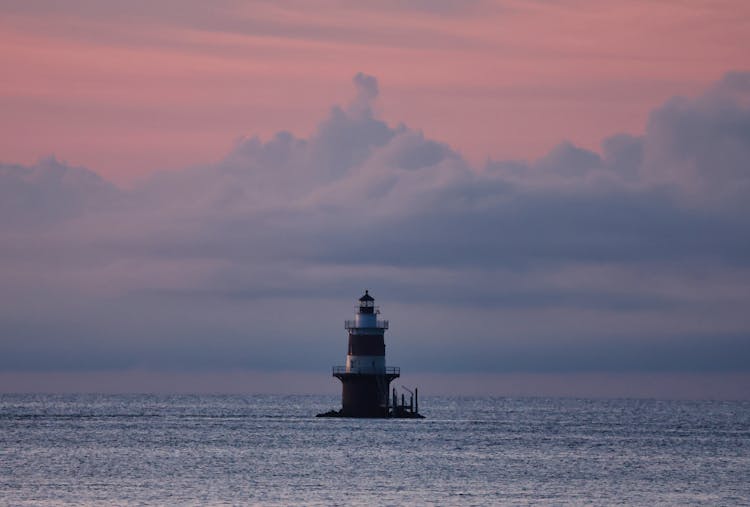 Lighthouse On The Ocean During Dawn