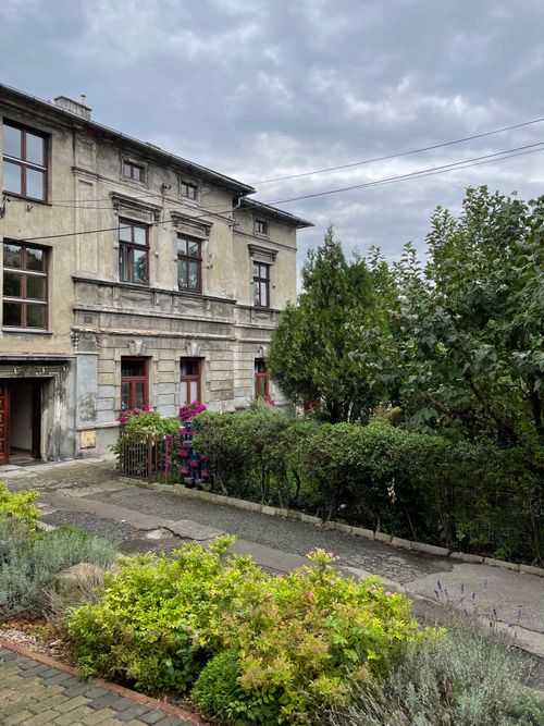 Free Vintage building with greenery under gray skies in Wieliczka, Lesser Poland. Stock Photo