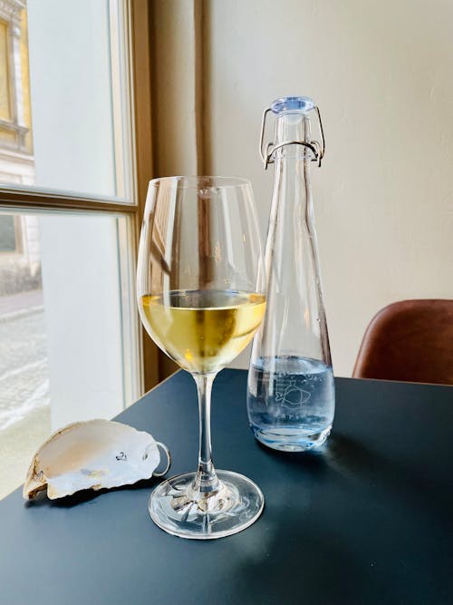 Wine Glass with Yellow Liquid Inside