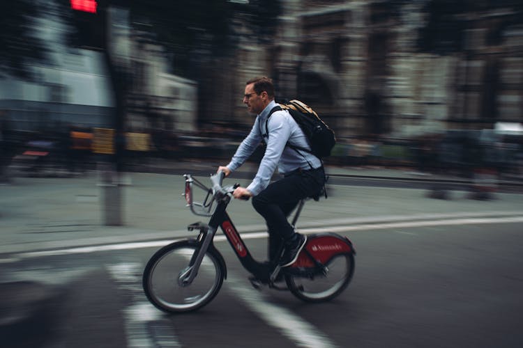 Man Riding A Bicycle In The City 