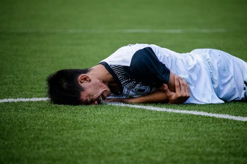 Free Man Crying on Field Stock Photo