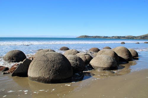 Free Spherical Boulders on Seashore Stock Photo