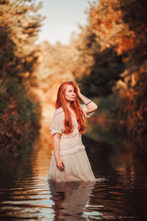 Free A Woman Standing in Water  Stock Photo