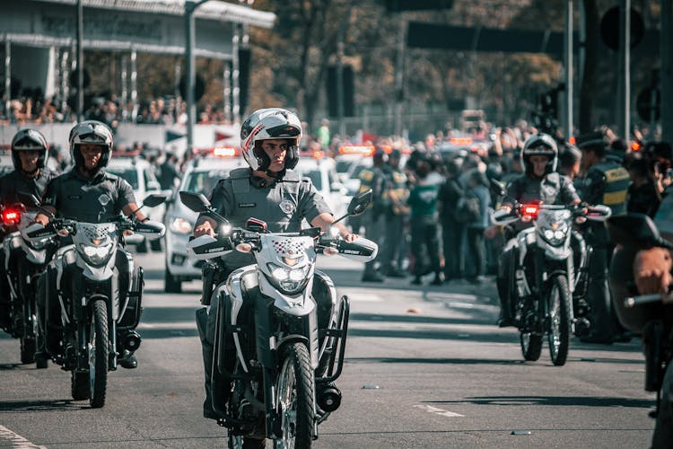 Police Officers Riding Motorbike On Street Parade