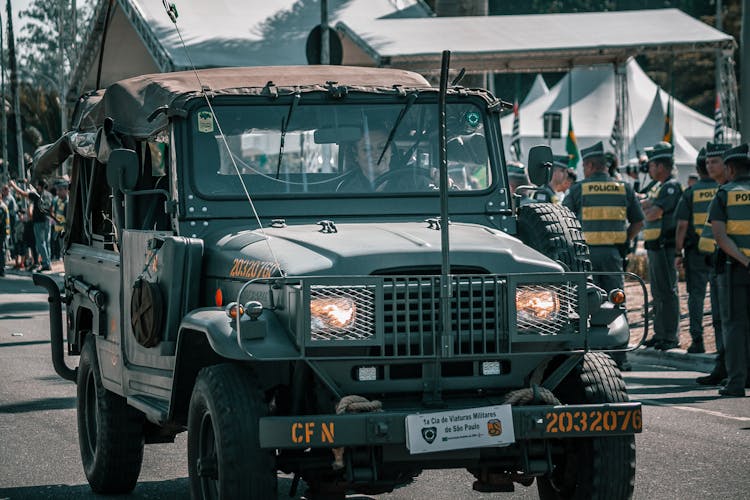 Woman Riding On Military Jeep Wrangler On Street Parade