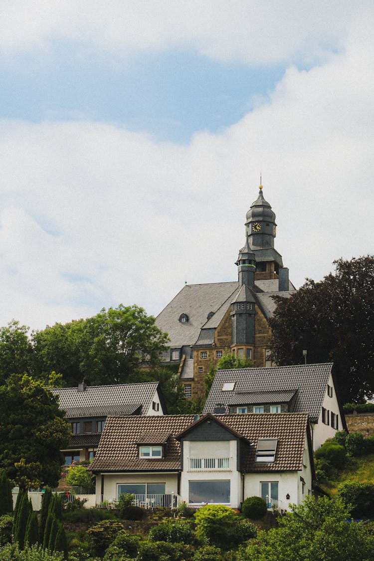 Houses And Church On Hill