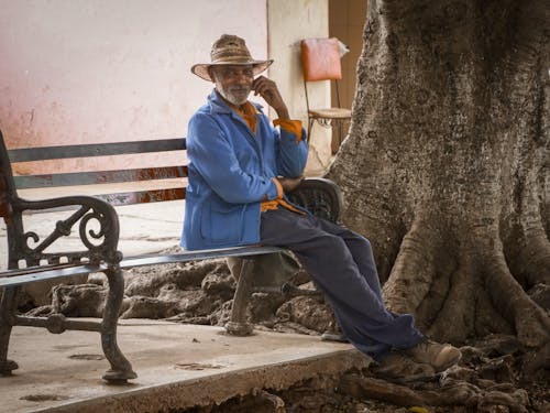 Elderly Man Sitting on a Bench