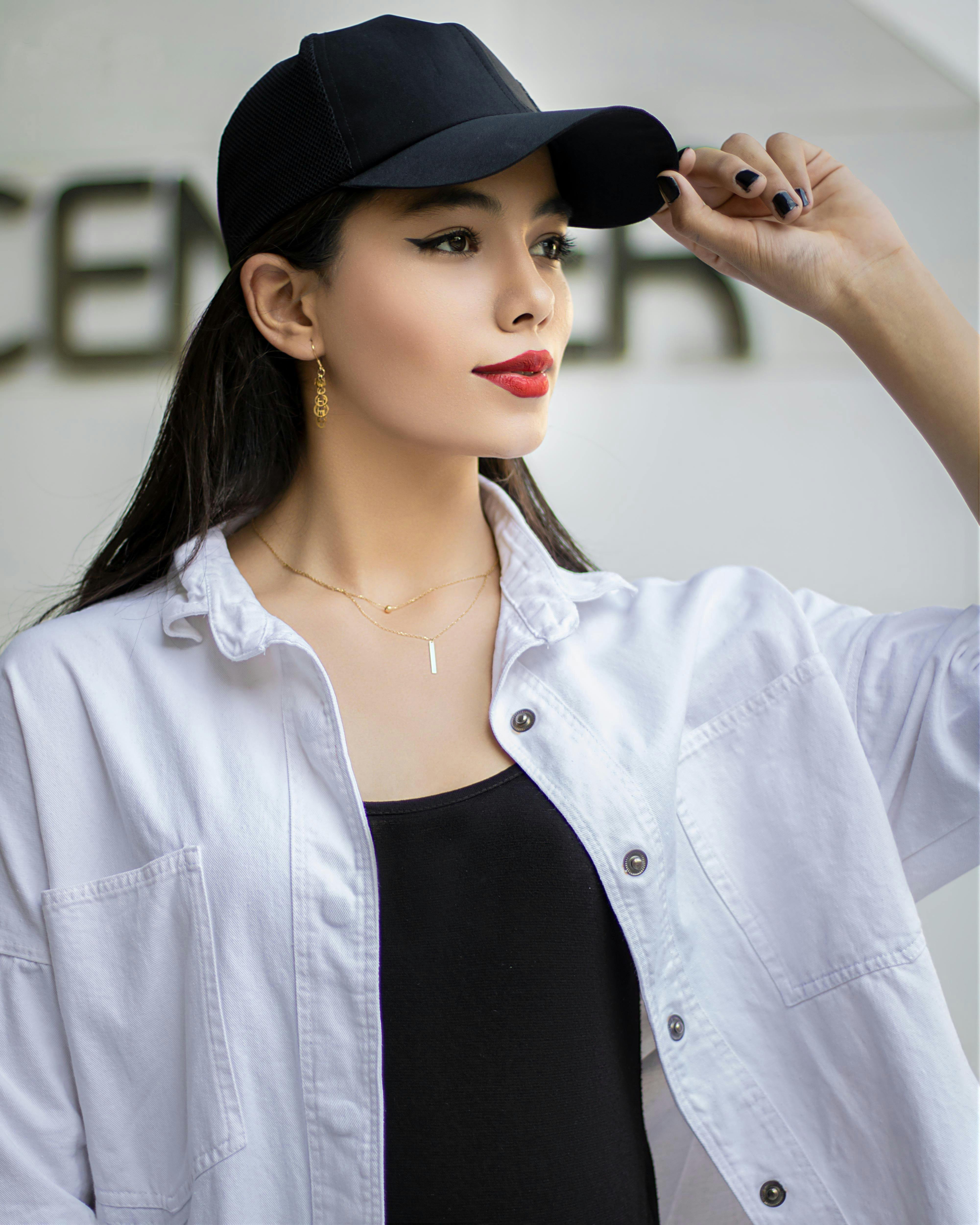 A Woman Wearing Black Cap with Red lips · Free Stock Photo