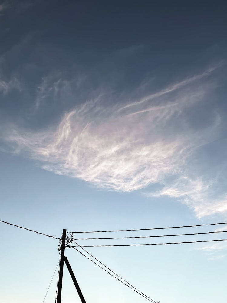 Electricity Lines Against Sky And Cloud