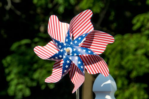 Free Close-up of a colorful pinwheel with an American flag pattern, outdoors. Stock Photo