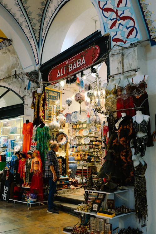 Man Standing in Front of a Shop