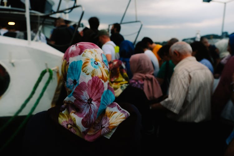 Woman In A Colorful Floral Headscarf