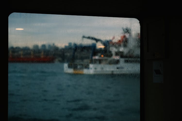 Ship Behind Vessel Window In Rain